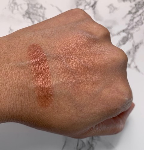 NARS Powder Blush Savage swatch on dark skin