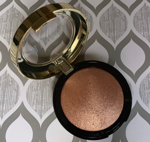 Milani Baked Highlighter 130 Rose Italiana Swatch on medium dark skin