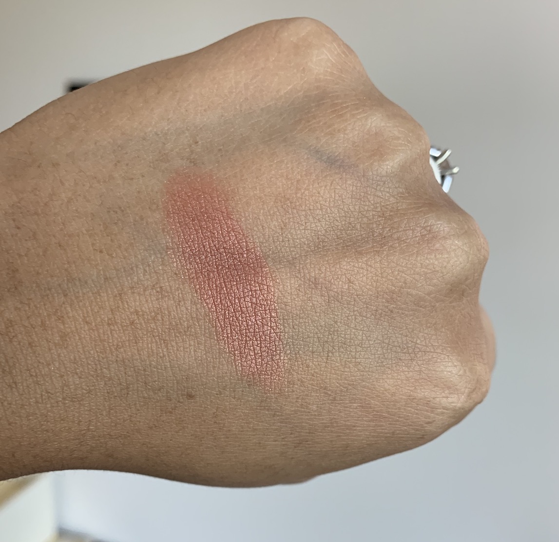 Milani Baked Powder Blush in Sunset Passione Swatch on medium dark skin