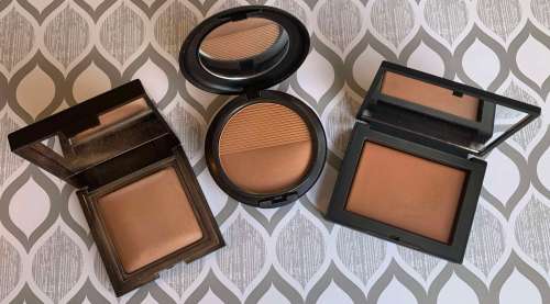 Laura Mercier Candleglow Sheer Perfecting Powder (5), MAC Studio Waterweight Pressed Powder (dark), and NARS Light Reflecting Pressed Setting Powder (sunstone) swatches on medium dark skin
