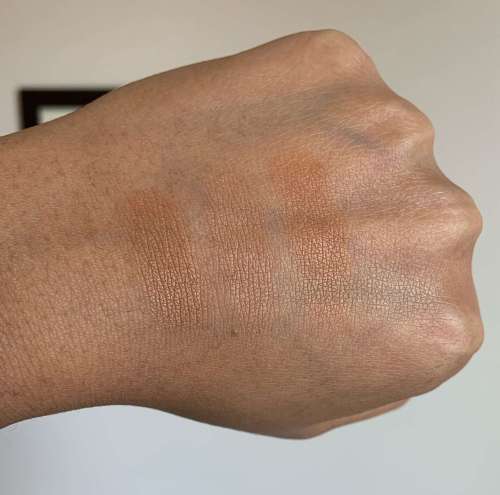 Swatches of Laura Mercier Candleglow Sheer Perfecting Powder (5), MAC Studio Waterweight Pressed Powder (dark), and NARS Light Reflecting Pressed Setting Powder (sunstone)
