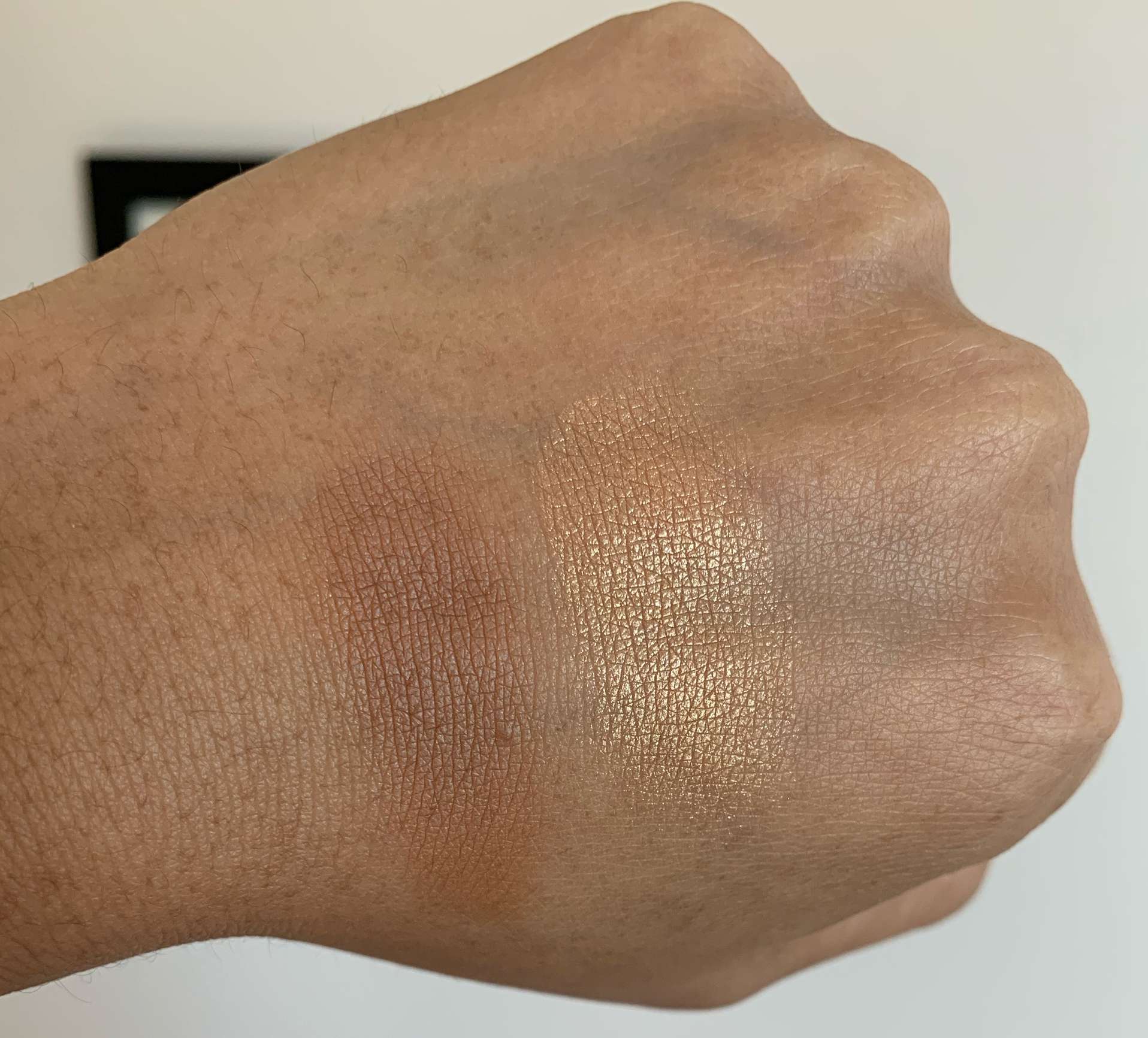 MAC Sun-Soaked Strip Bronzer and Selena La Layenda Highlighter swatches on Medium Dark Skin