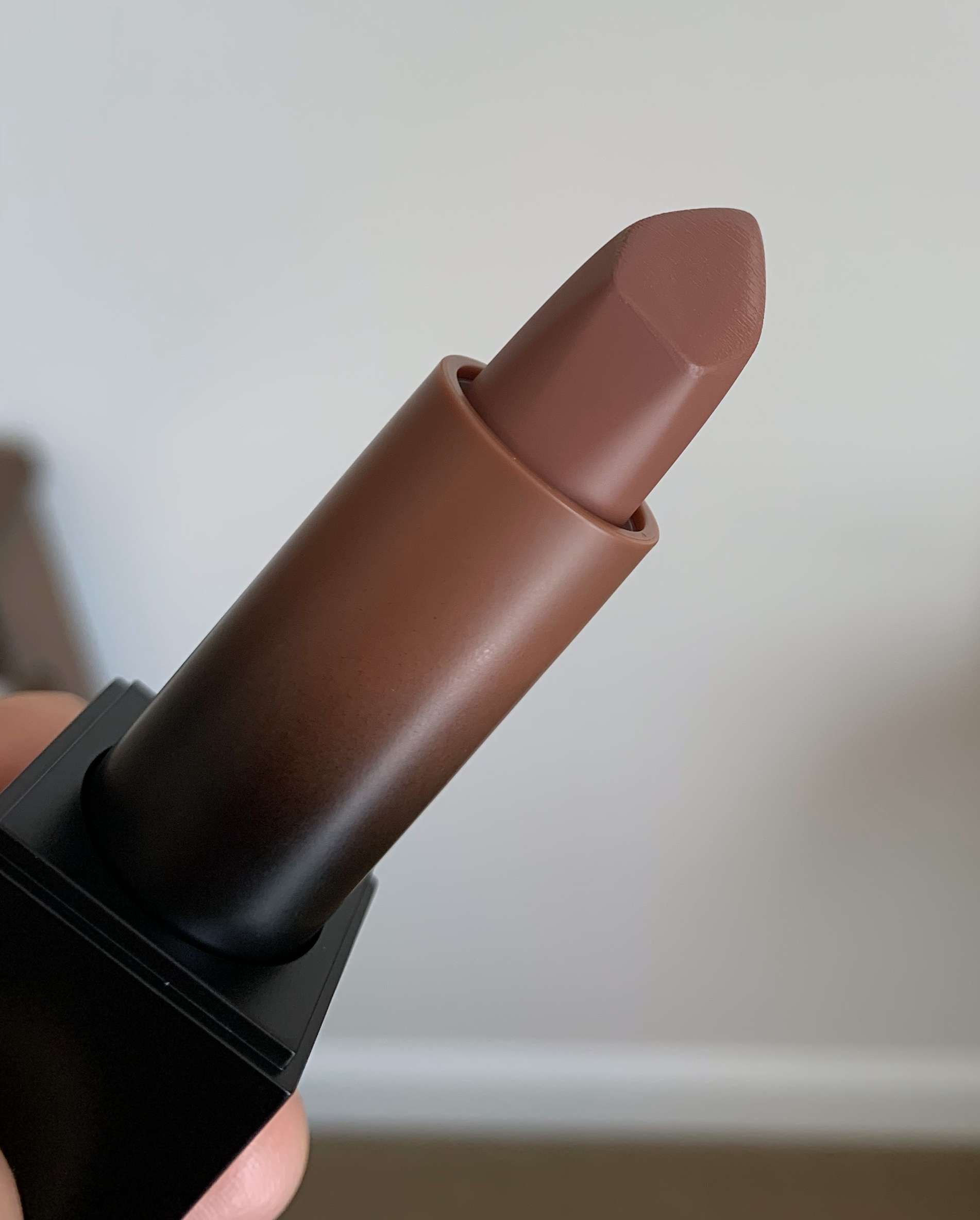 Huda Beauty Money Maker Power Bullet Cream Glow Hydrating Lipstick Money Maker Swatch on Medium Dark Skin