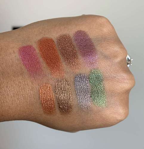 Urban Decay Born To Run Palette Swatches on Medium Dark Skin (shade names: wildheart, accelerate, double life, guilt trip, ignite, smog, drift, wanderlust)