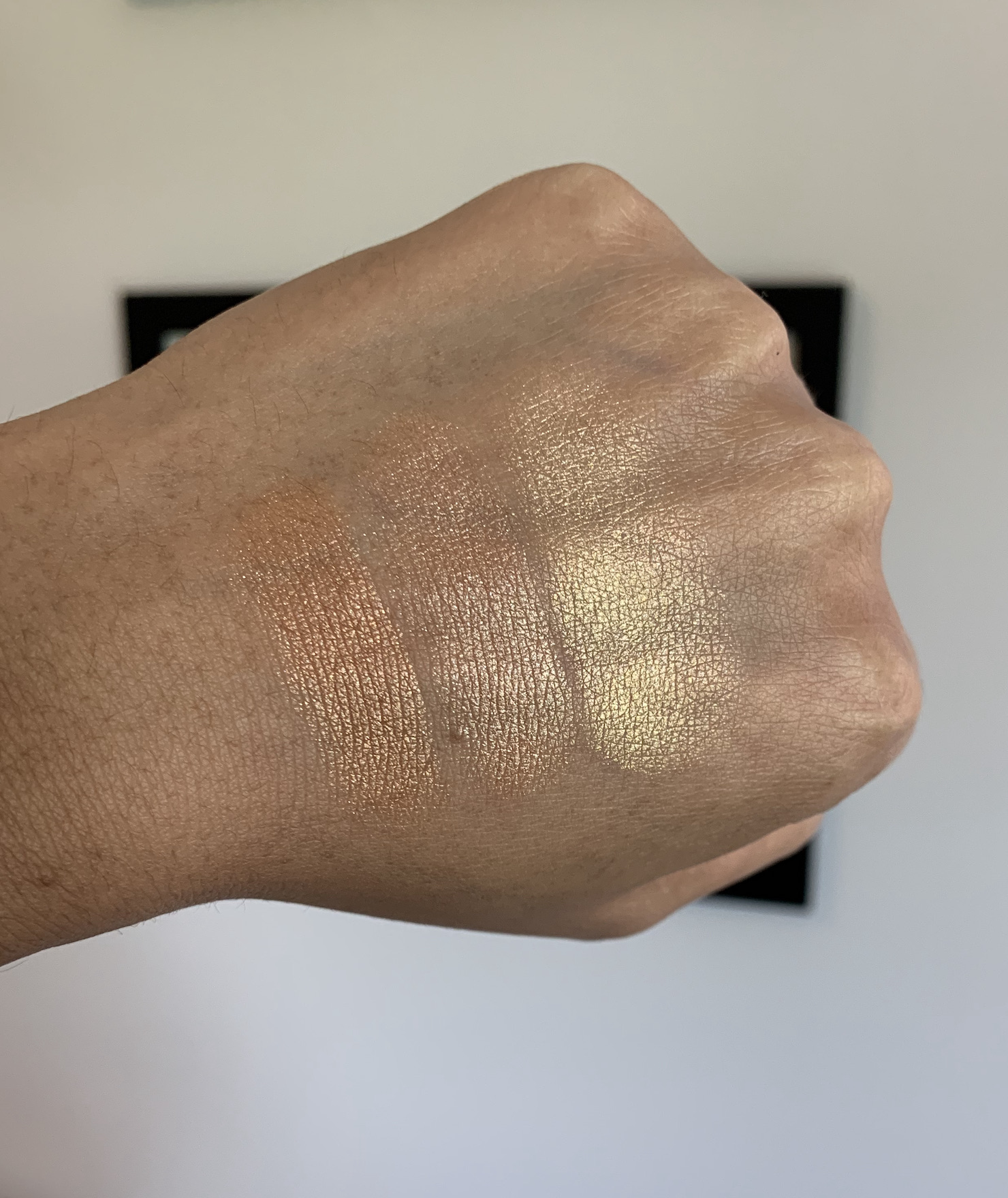 Colour Pop Super Shock Highlighters Mind Over Matter, Parasol, and 100 Aker Wood Swatches on Medium Dark Skin