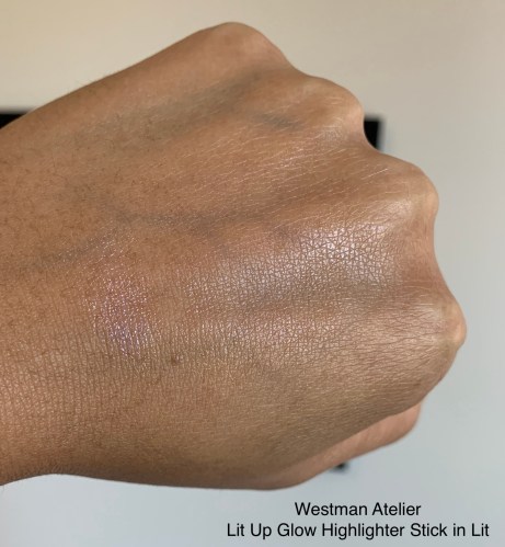 Westman Atelier Lit Up Glow Highlighter Stick in Lit Swatch Medium Dark Skin