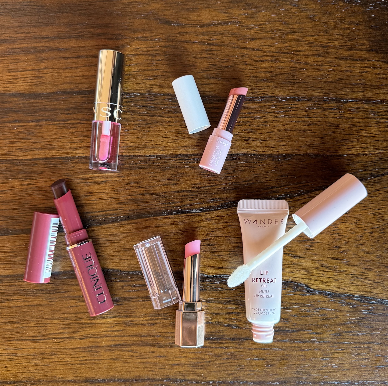 Clarins Lip Comfort Oil Pitaya, Clinique Almost Lipstick Black Honey, Lancome Lip Idole Butterglow Keep It Glowy, Tarte Maracuja Juicy Lip Balm Rose, and Wander Beauty Lip Retreat Oil Oasis Glow Review and Swatches