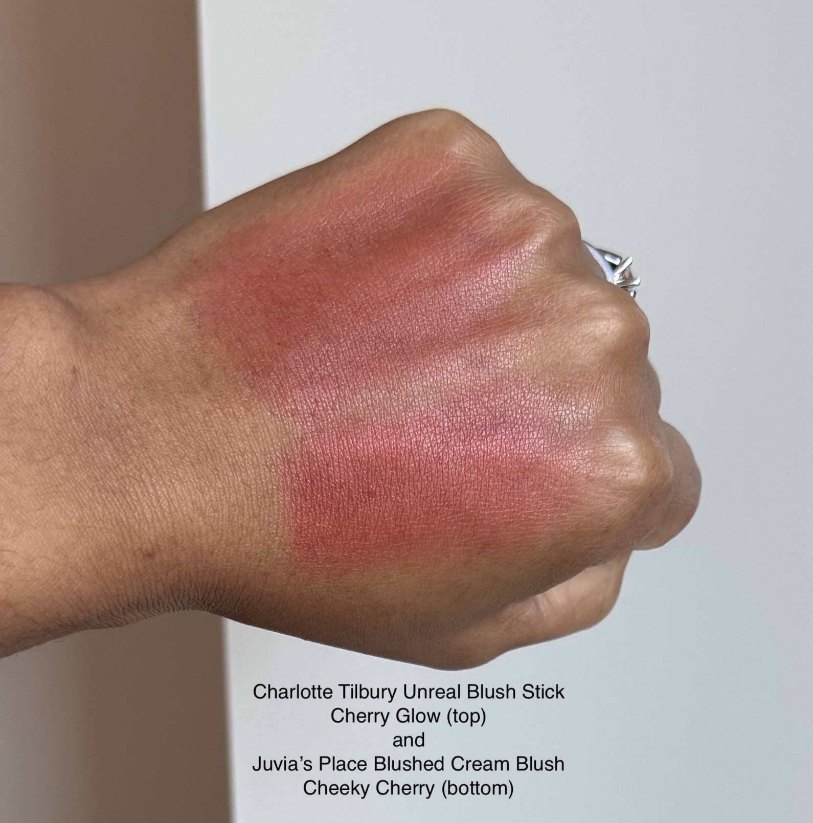Charlotte Tilbury Unreal Blush Stick Cherry Glow and Juvia’s Place Blushed Cream Blush Cheeky Cherry Swatches Medium Deep Skin woc